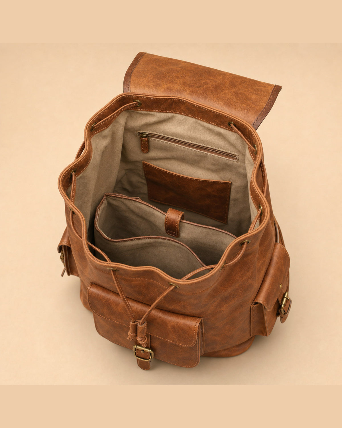 Open interior of DEKVIO leather backpack showing striped canvas lining and main compartment