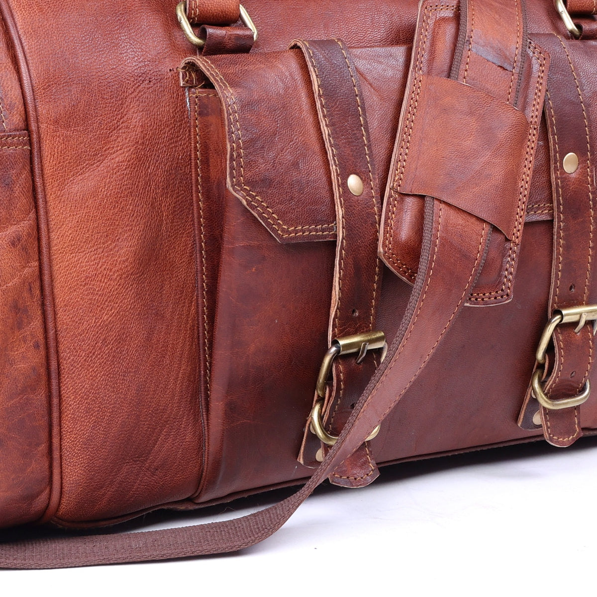DEKVIO leather gym duffle — antique brass buckles and front pocket close-up