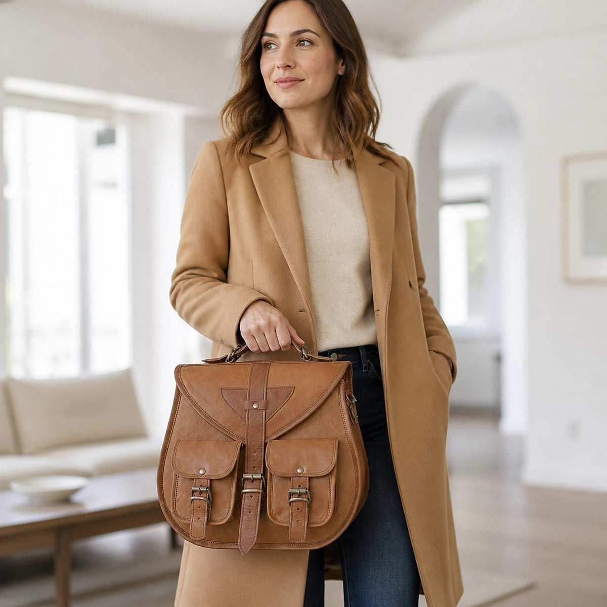 DEKVIO 13 inch leather handbag carried by its removable top handle