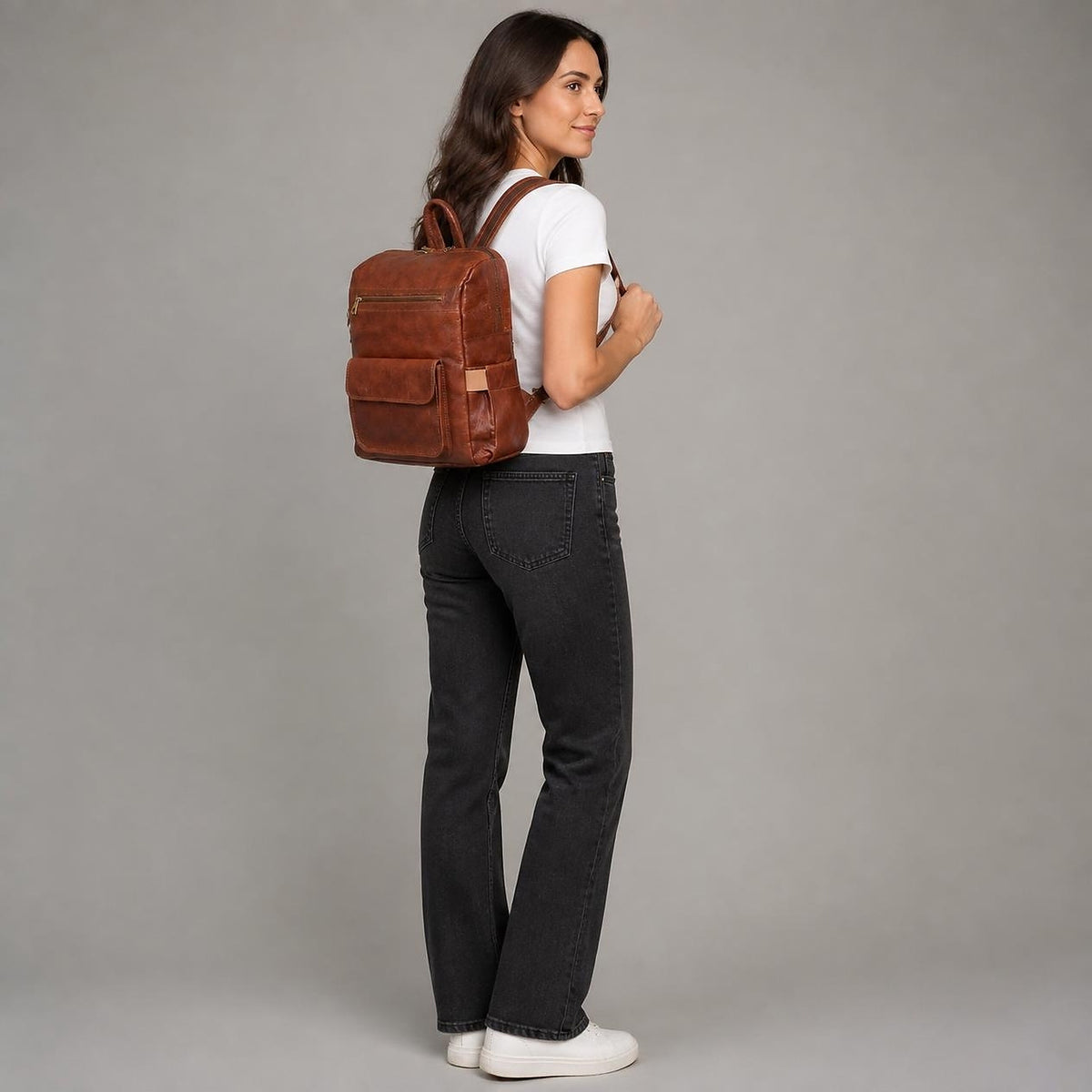 DEKVIO 16 inch leather backpack for women shown at true size, sits at the mid-back