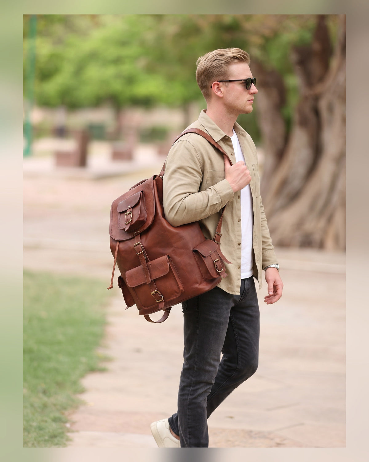 Man carrying the DEKVIO leather laptop backpack on his commute to the office