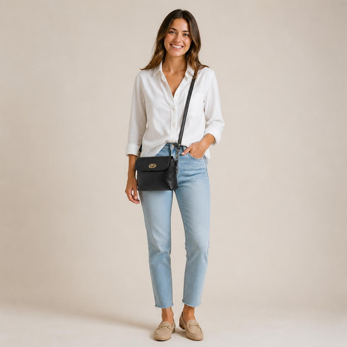DEKVIO 10 inch turn-lock crossbody purse shown at true size on a woman